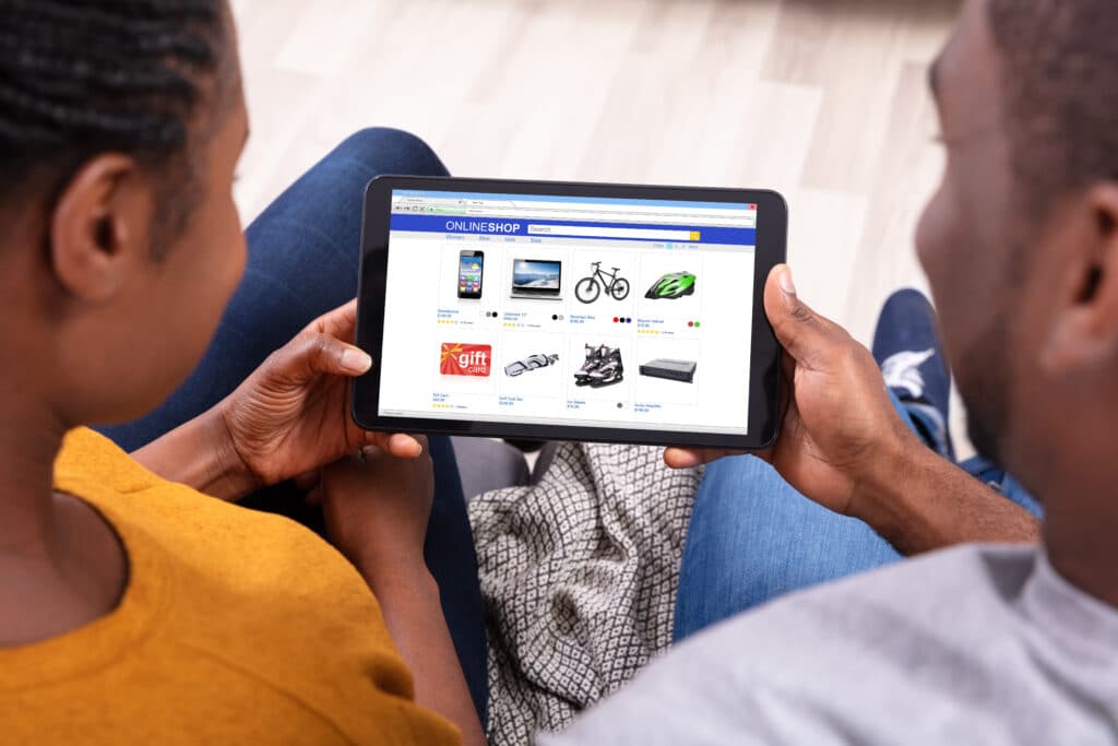 Couple Shopping Online On Digital Tablet Couple Shopping Online On Digital Tablet